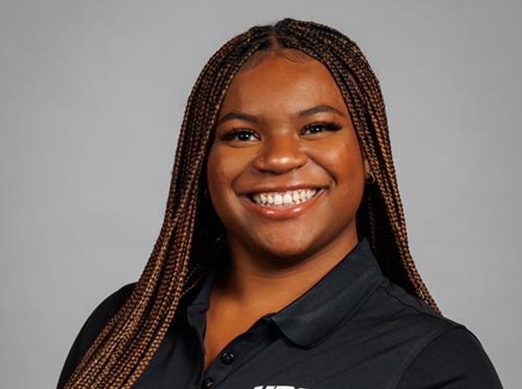 A young woman smiles for the camera