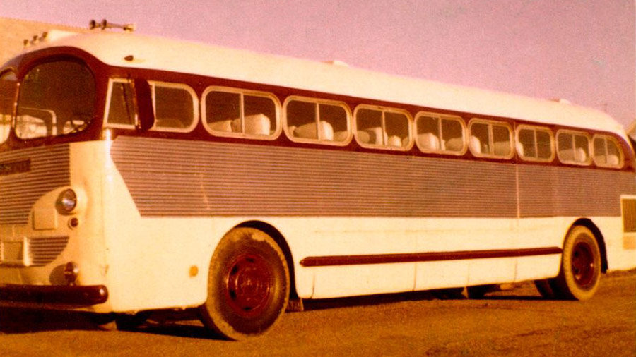 An old photo shows a motor coach.