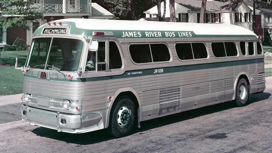 Silver bus in a residential area
