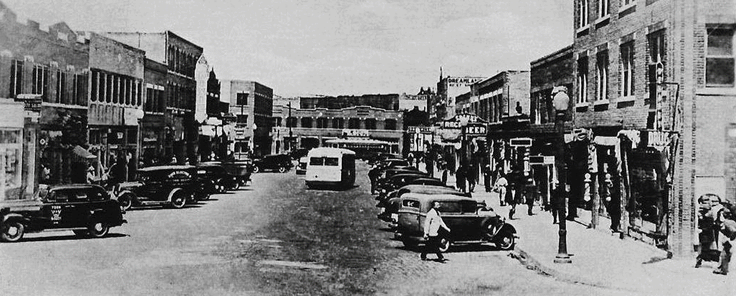 Gif. 1st image: a street scene from the turn of the 20th Century, Tulsa. 2nd image: 