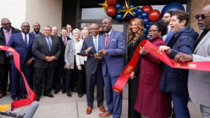 A group of people attend the ribbon cutting ceremony for First Independence Bank in Minnesota