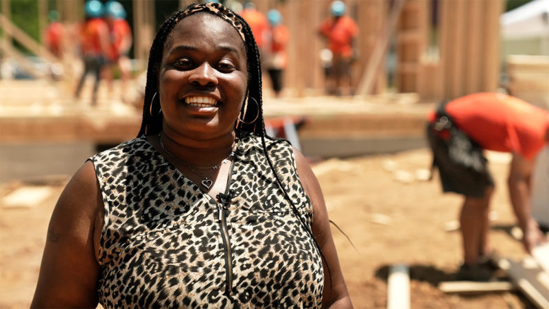 Shaquawanda smiling during an interview at the site where her home is being built.