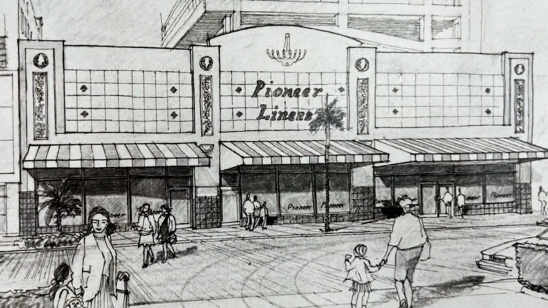 A black and white illustration depicts Pioneer Linens and the surrounding shopping area.