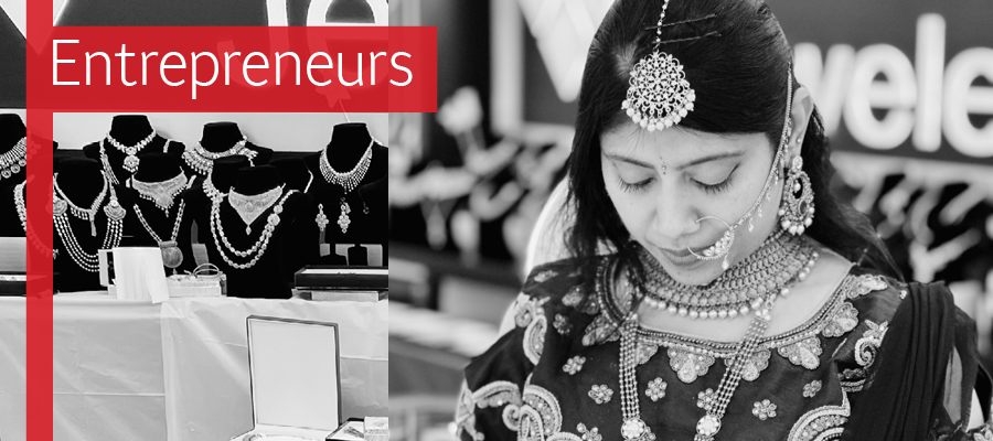 The text Entrepreneurs over a black and white image of a woman in elaborate jewelry