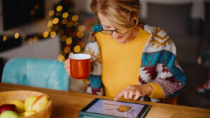 Woman reviewing tips to avoid holiday scams