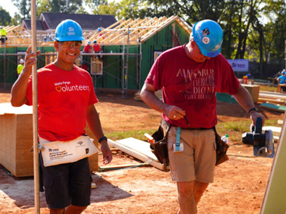 Two people working at a construction site