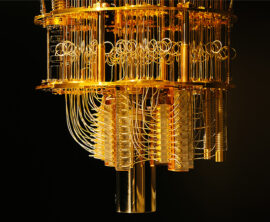 An image of a quantum computer that looks like a gold chandelier, next to a quote from Chintan Mehta: It could be exponentially faster than anything we have today – if we reach there it will blow up everything else in terms of speed and efficiency.