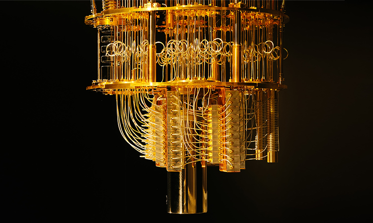 An image of a quantum computer that looks like a gold chandelier, next to a quote from Chintan Mehta: It could be exponentially faster than anything we have today – if we reach there it will blow up everything else in terms of speed and efficiency.