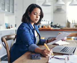 Woman reviewing tips to pay less taxes.
