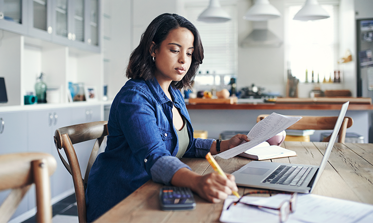 Woman reviewing tips to pay less taxes.