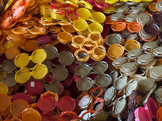A pile of colorful plastic caps