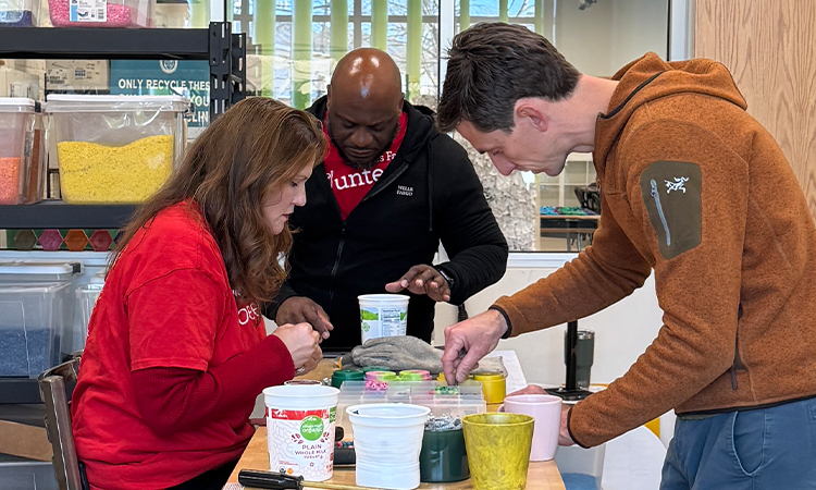 Wells Fargo employees make crafts out of reusable plastic.