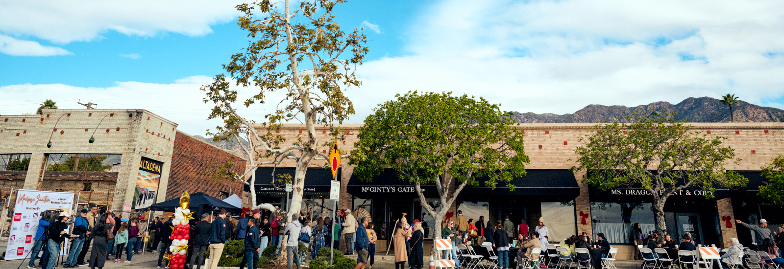 A group of people stand together at an outdoor LA Wildfire relief event.