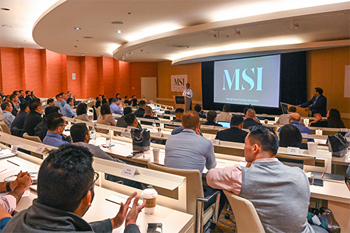 The MSI team sits in a lecture hall seminar