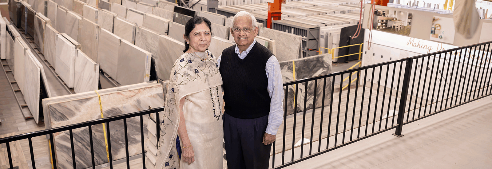 Manu and Rika Shah, Co-Founders of MSI stand in front of their natural stone warehouse and showroom.