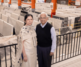 Manu and Rika Shah, Co-Founders of MSI stand in front of their natural stone warehouse and showroom.