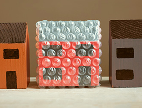 A bubble-wrapped cardboard house