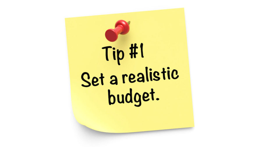 “Tip #1 Set a realistic budget” is on a yellow sticky note with a red pin on white background.