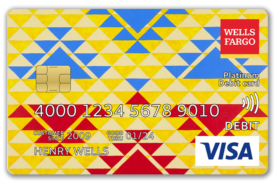 A Wells Fargo debit card features an art piece that uses red, yellow, and blue triangles.